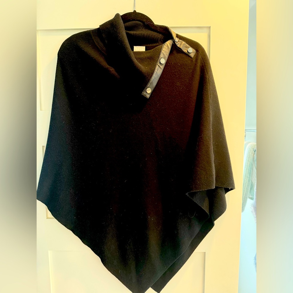 Black cotton poncho with vegan leather trim by Chico’s.